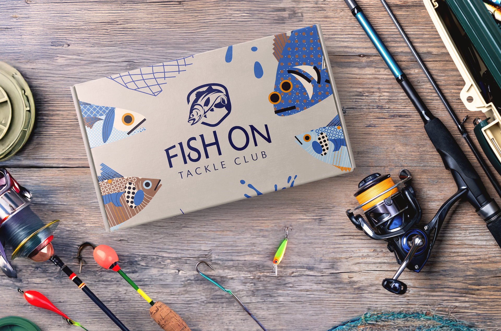 Fishing subscription box on deck surrounded by fishing gear